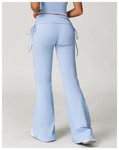 Legging évasé de sport Beauté & Santé avec cordon de serrage bleu, vue arrière, tissu extensible et confortable.