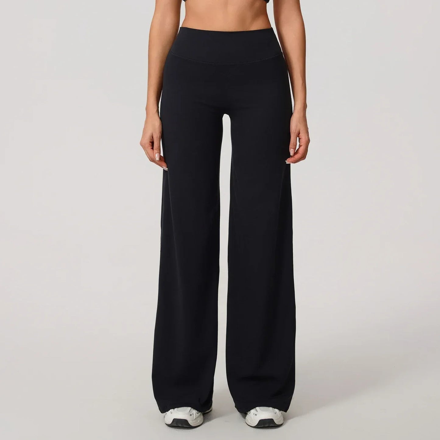 Legging de yoga décontracté de Beauté & Santé avec coupe évasée, tissu confortable et style sportif pour la pratique ou la détente.